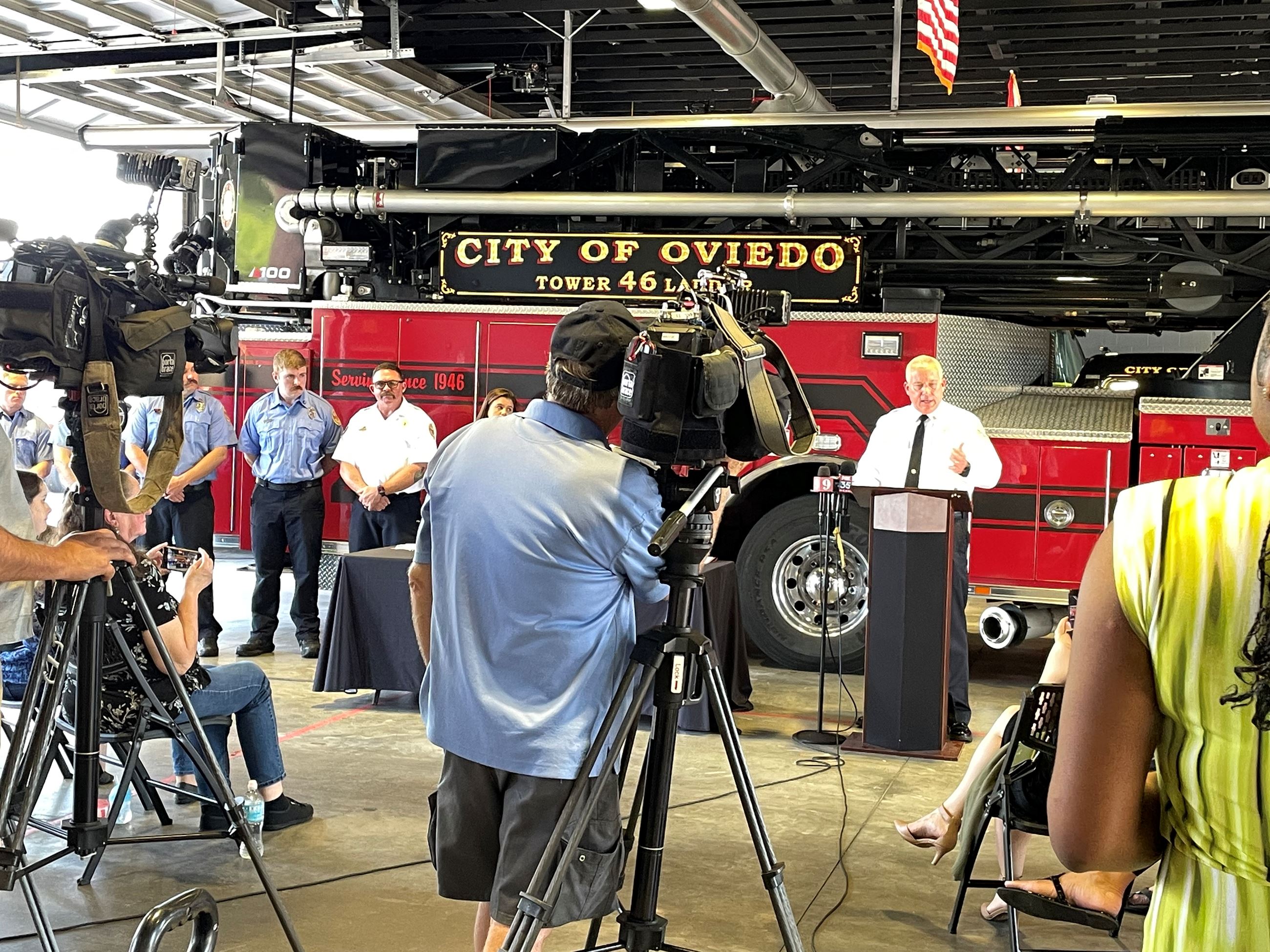 Chief Woodward at Podium with Media