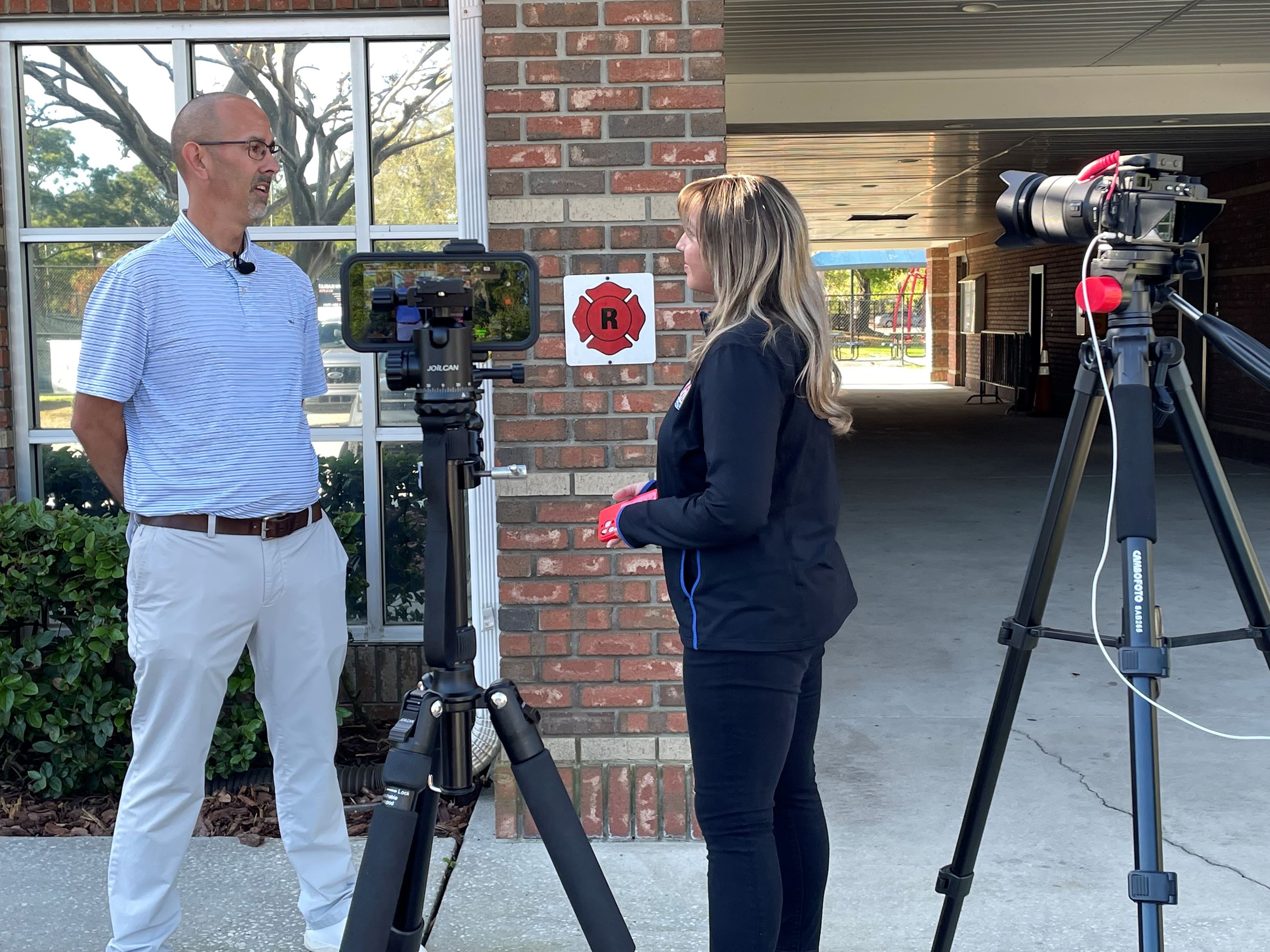 Paul Belden being interviewed by WKMG 