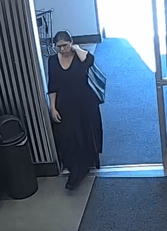 White female dark hair wearing a black dress